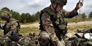 Combat medics treating a casualty in a field environment.